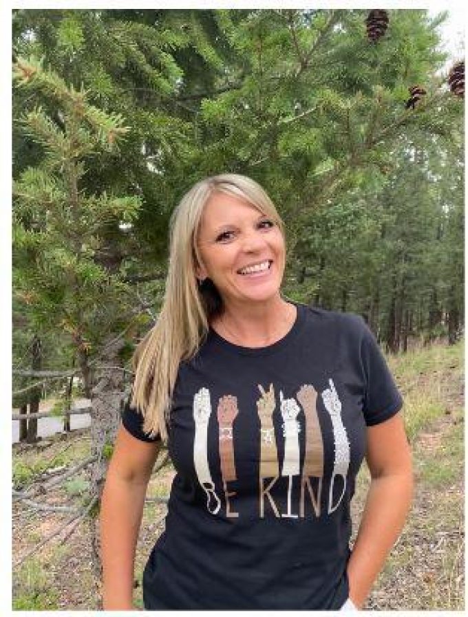 woman with be kind shirt